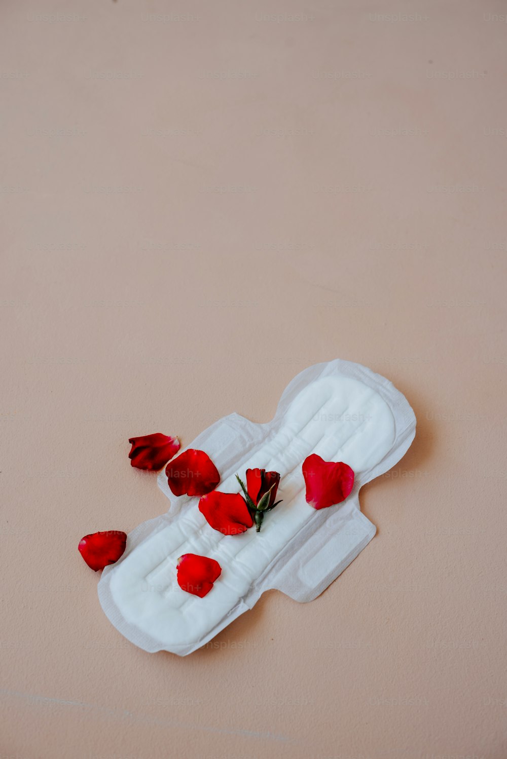 a white object with red flowers on it