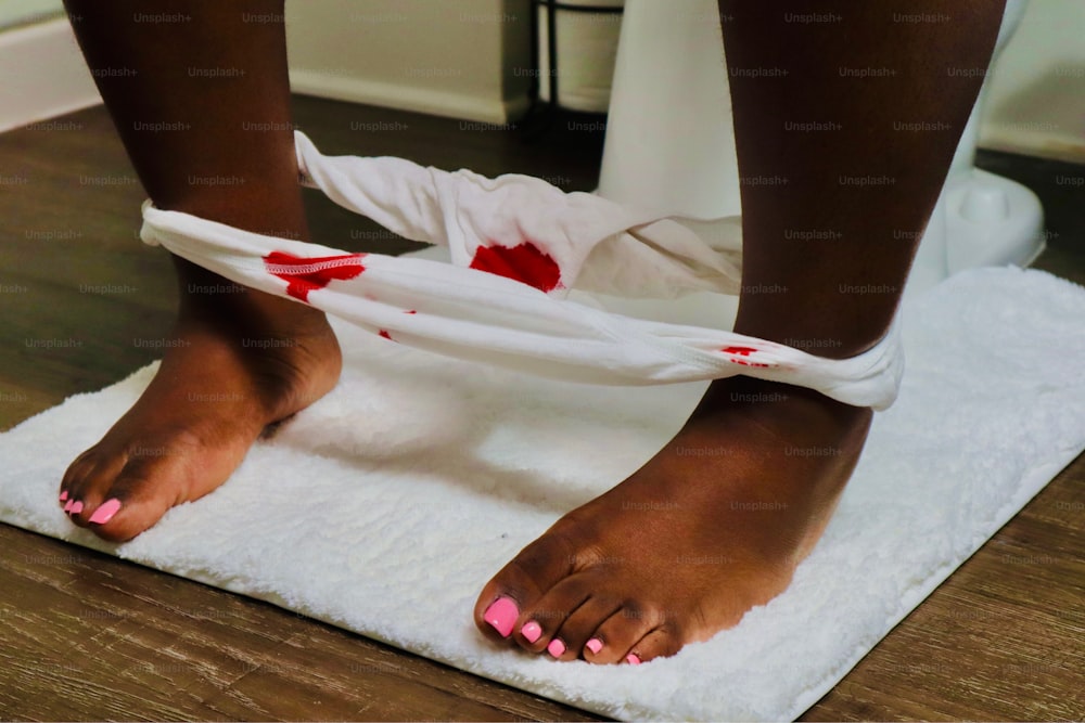 a close up of a person's bare feet on a towel
