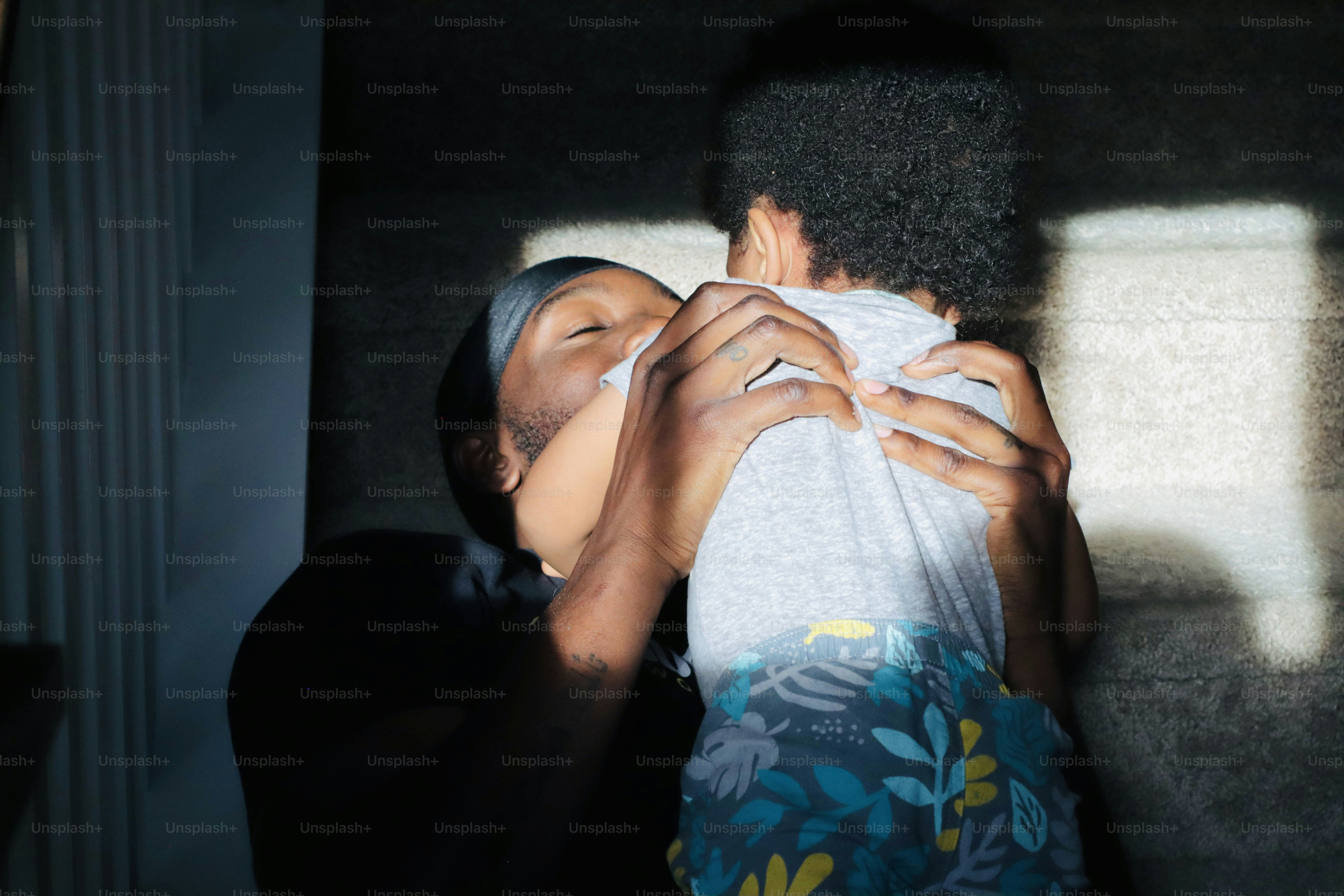 a woman covering her face with a towel