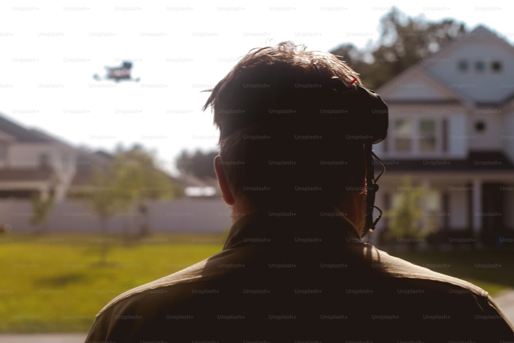 a man standing in front of a house