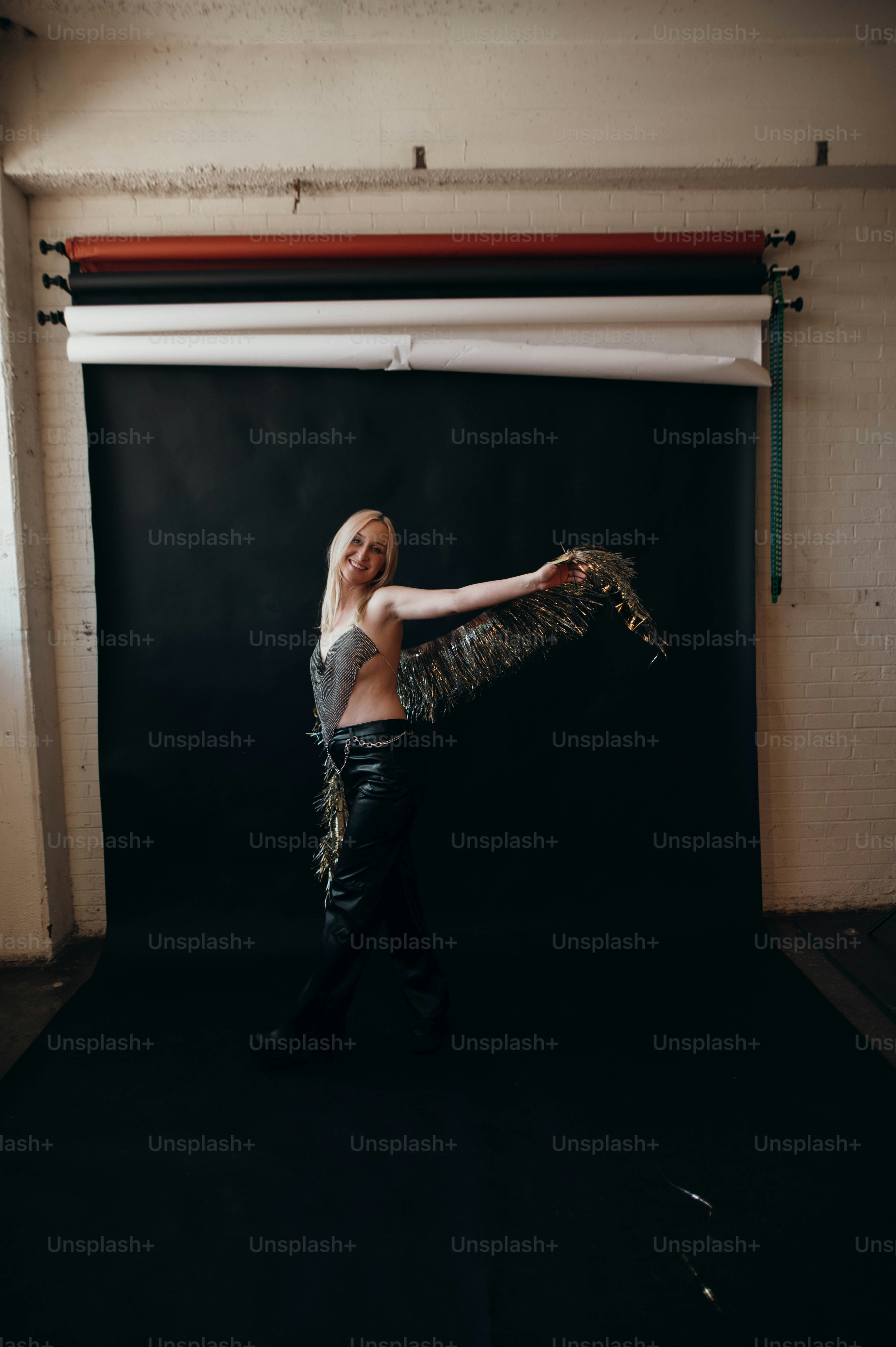 a woman in a black top is dancing