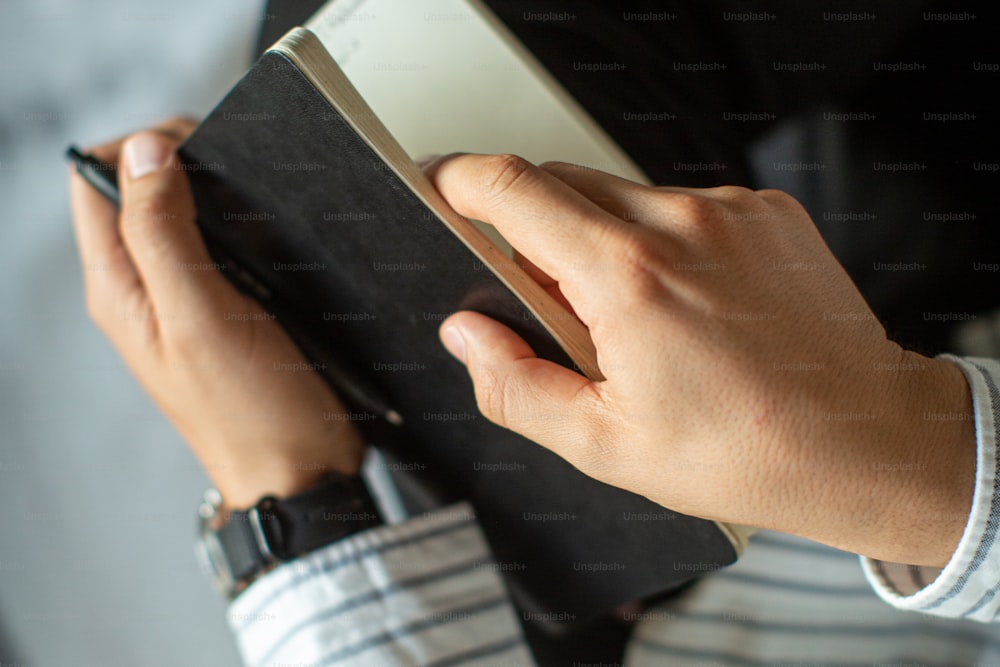 a person holding a book in their hands