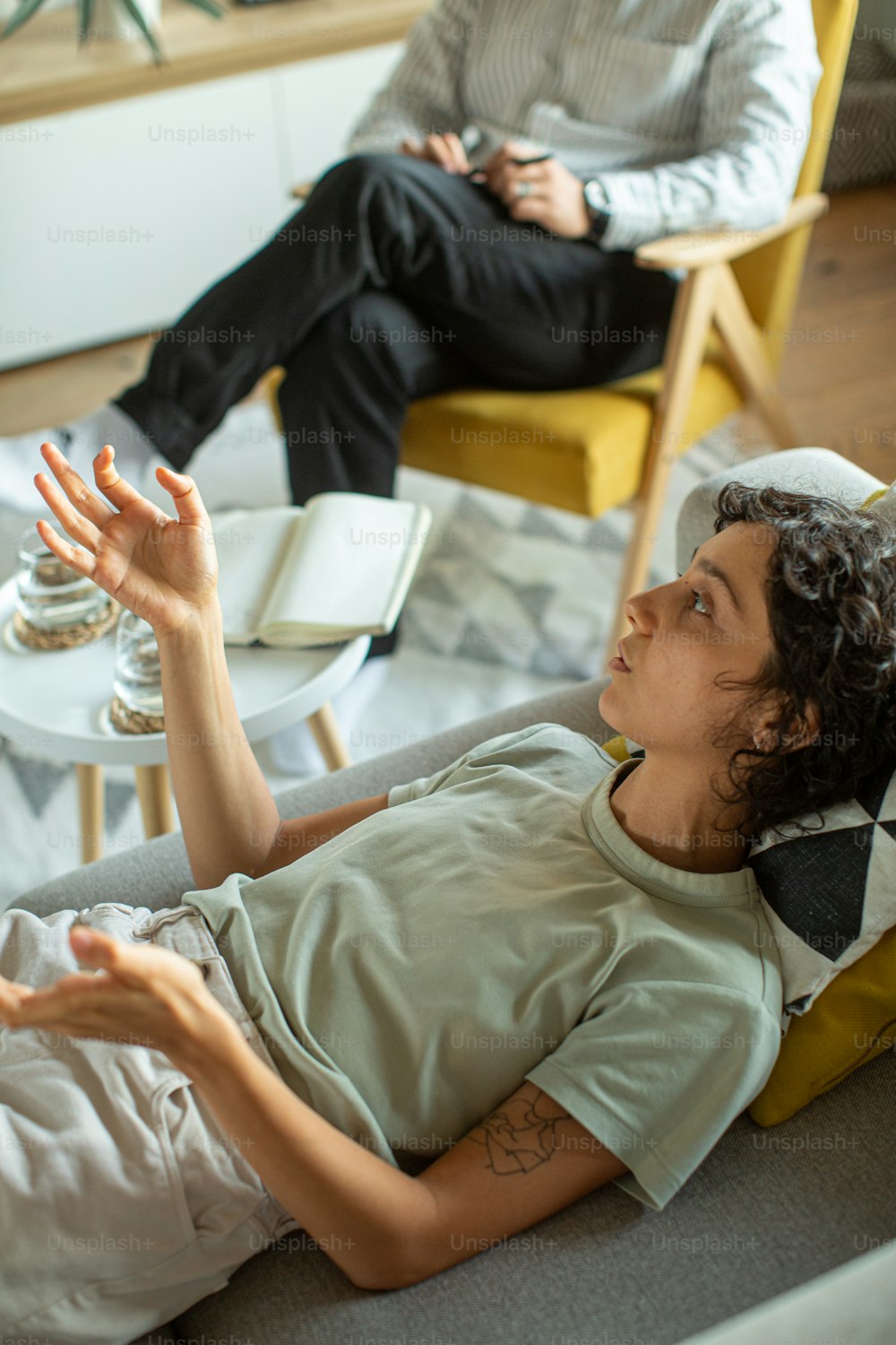 a man sitting on a couch in a living room