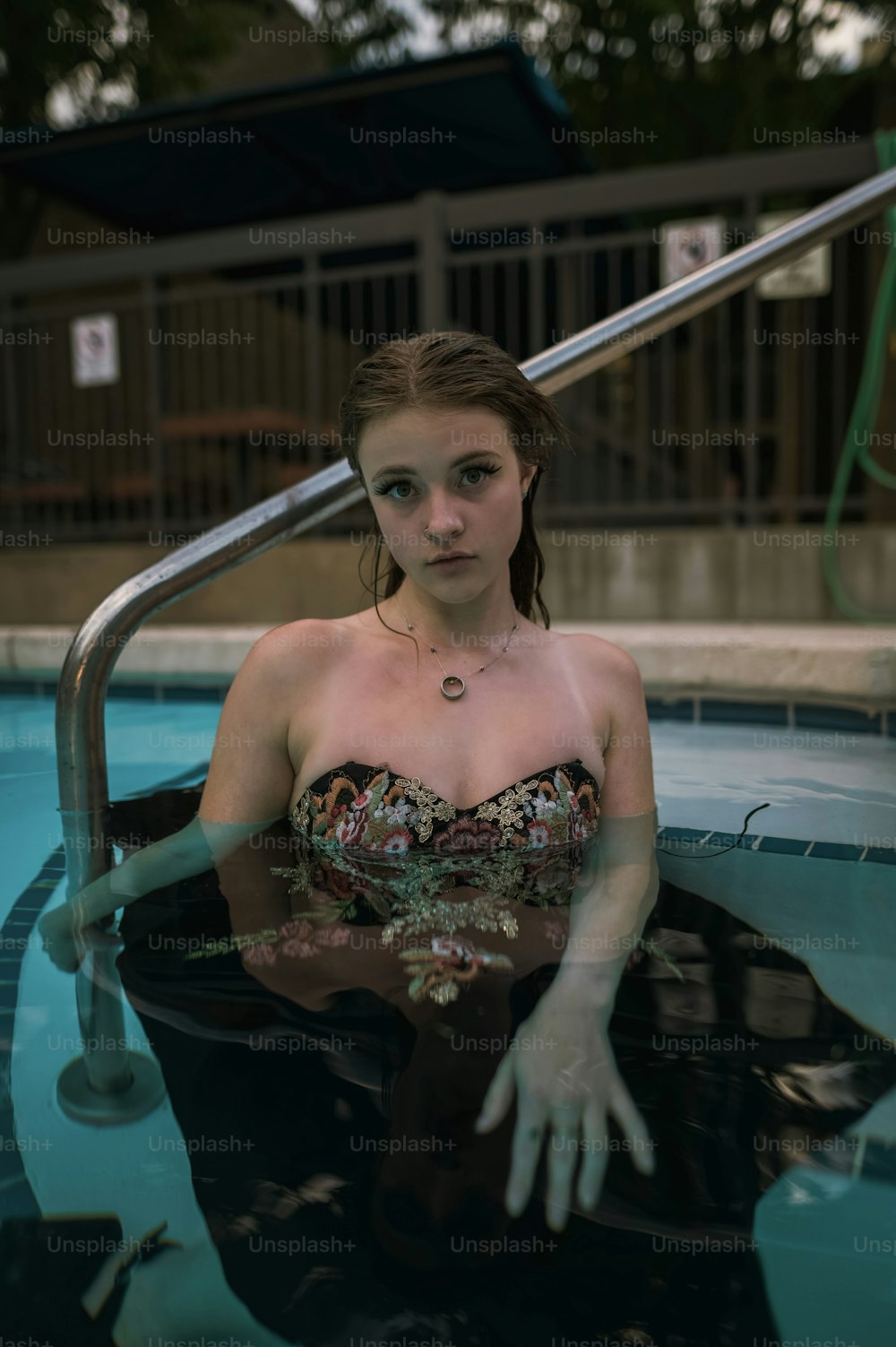 a woman sitting in a pool of water