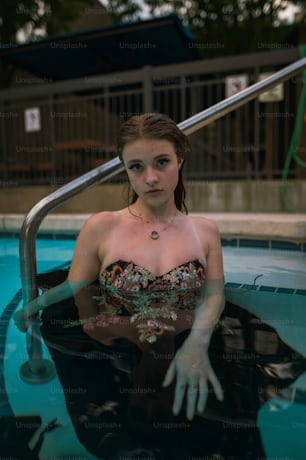 a woman sitting in a pool of water