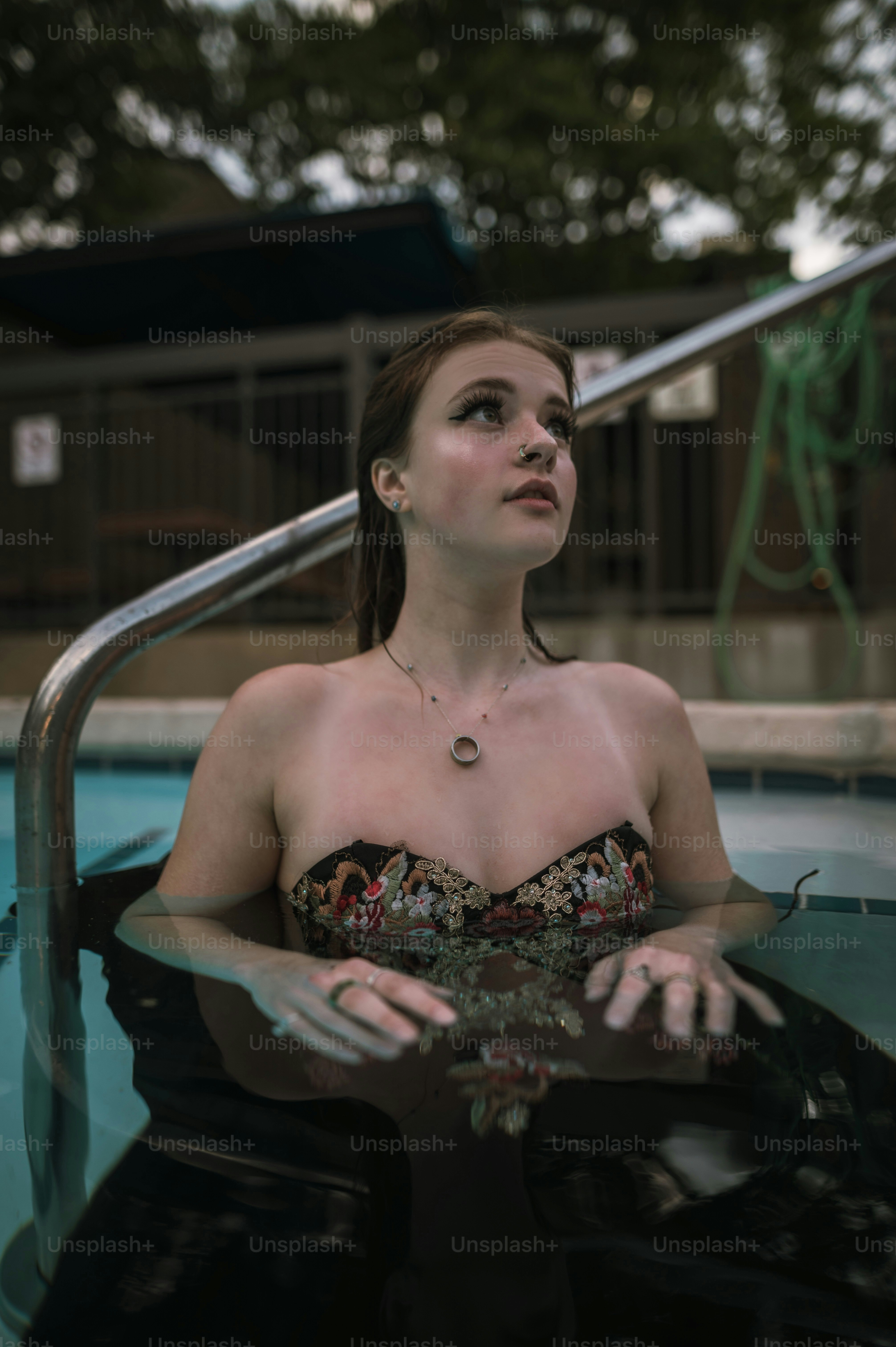 a woman sitting in a pool of water