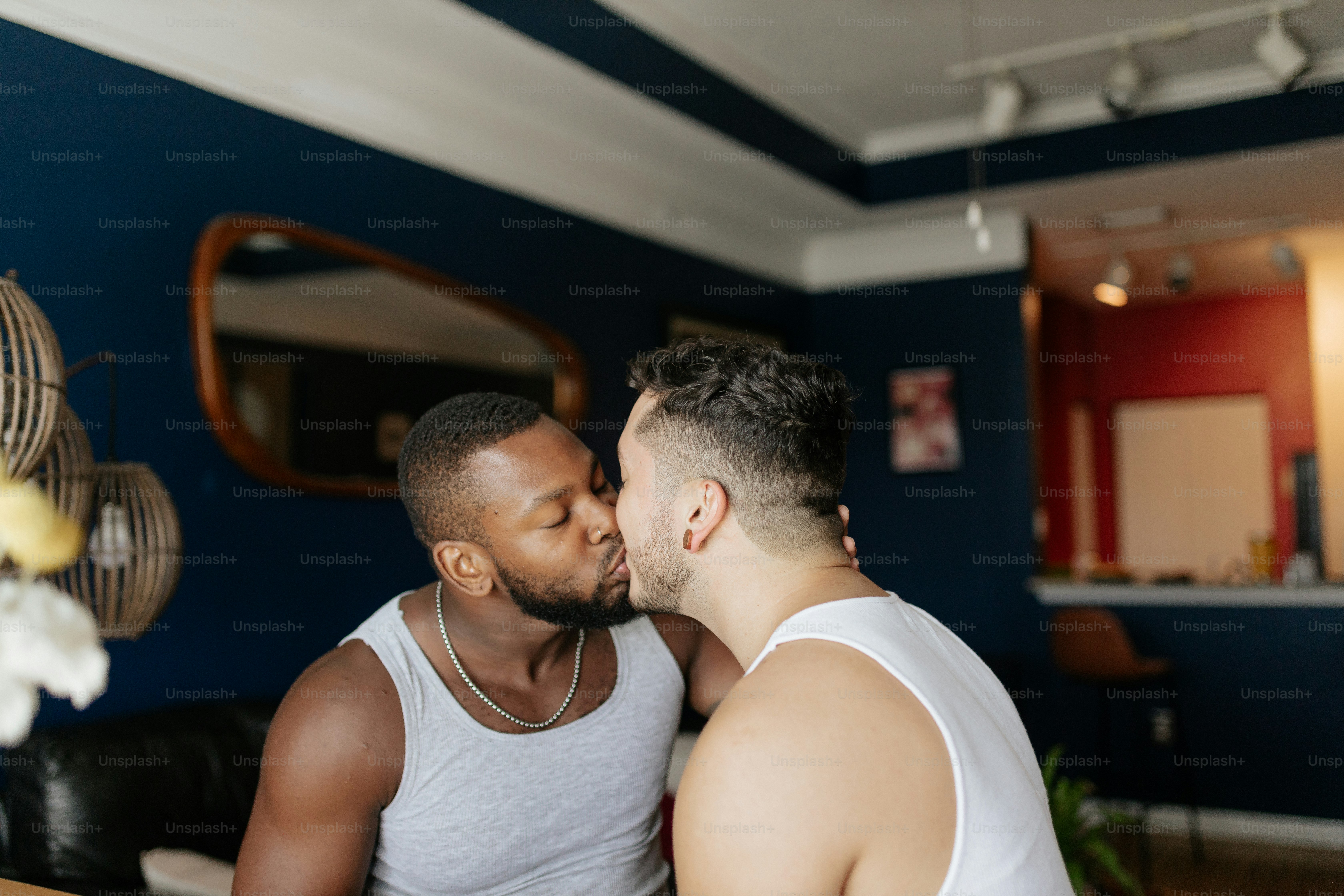 a couple of men sitting next to each other