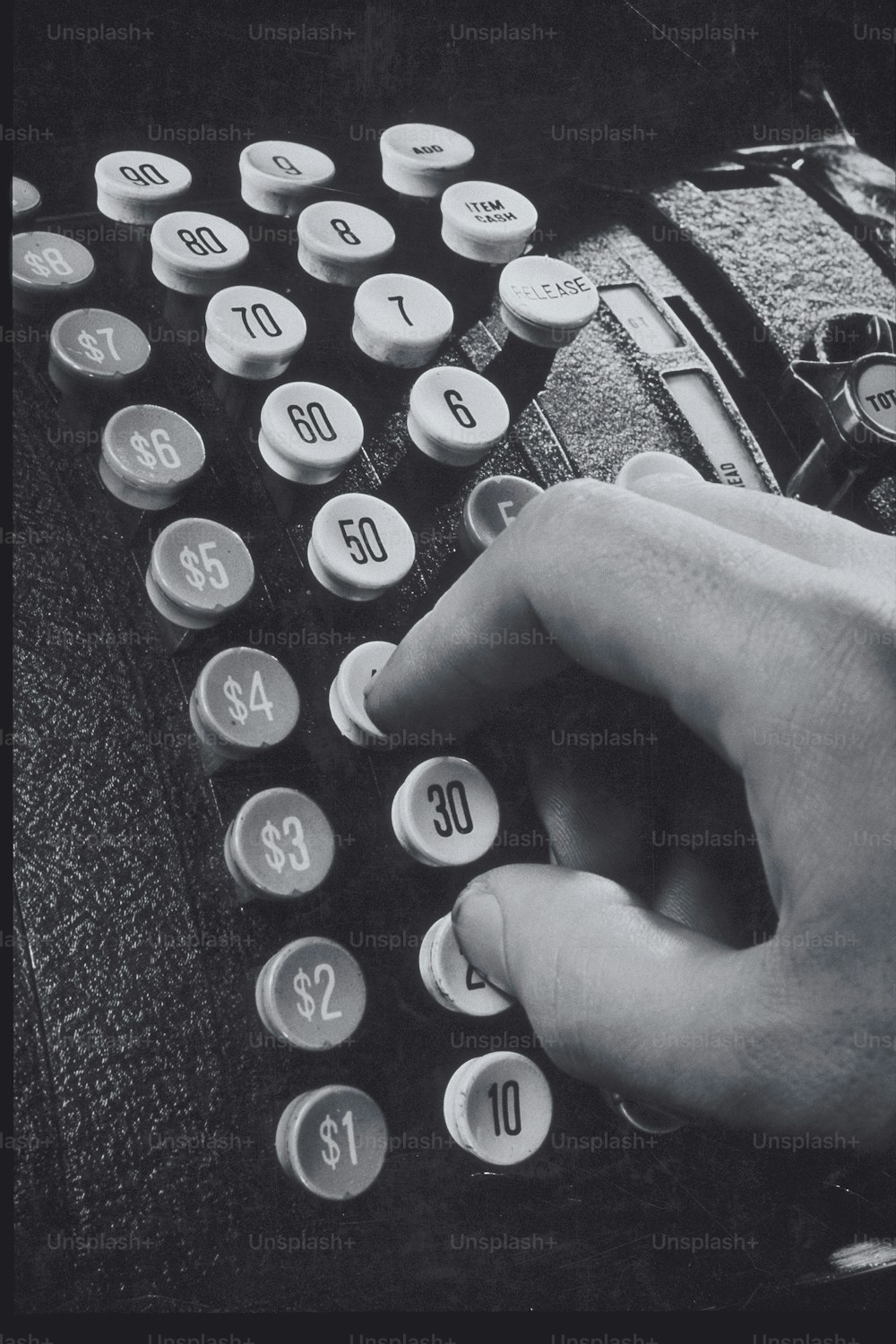 a person typing on an old fashioned typewriter