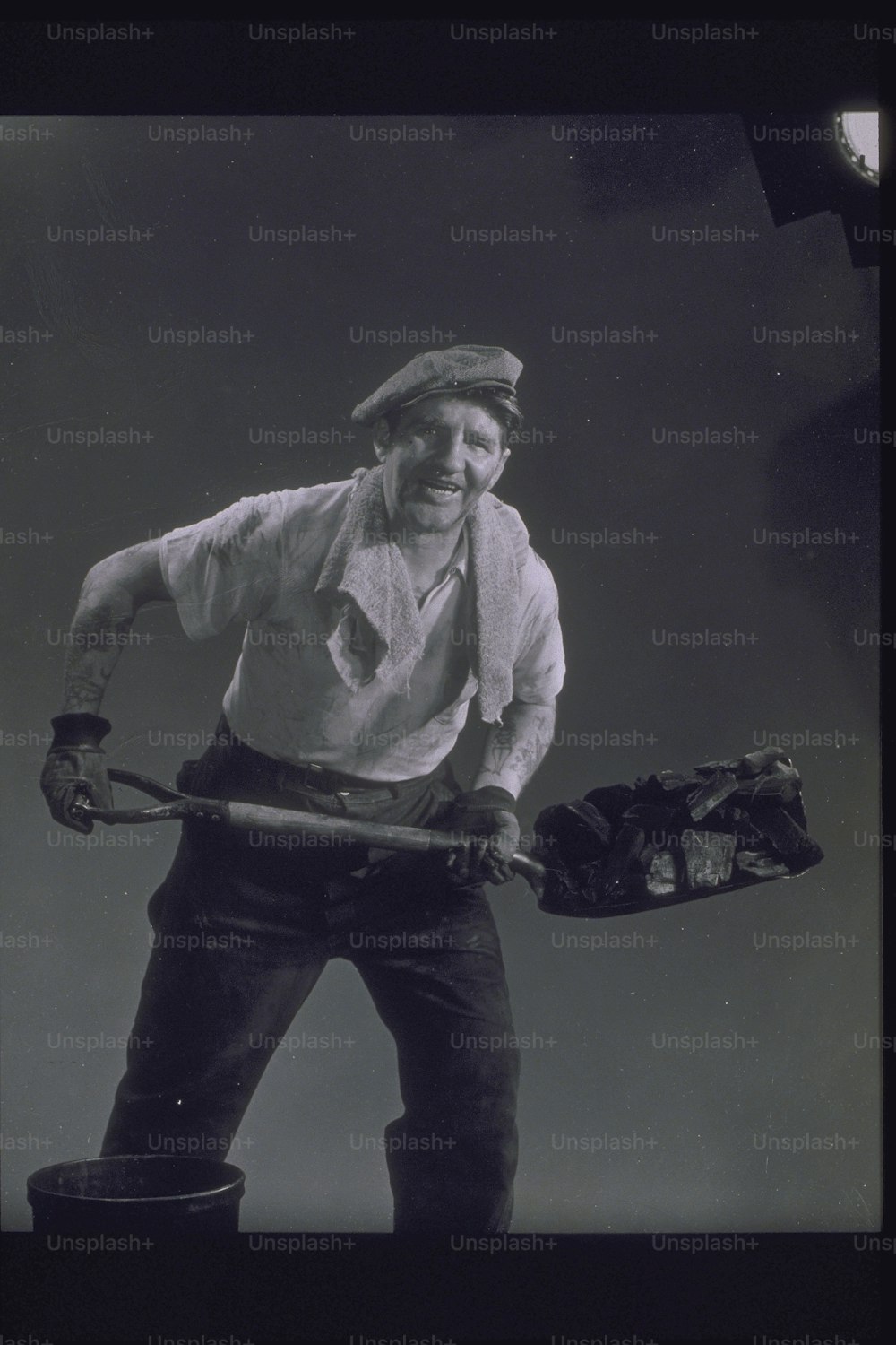 a man holding a baseball bat and a catchers mitt