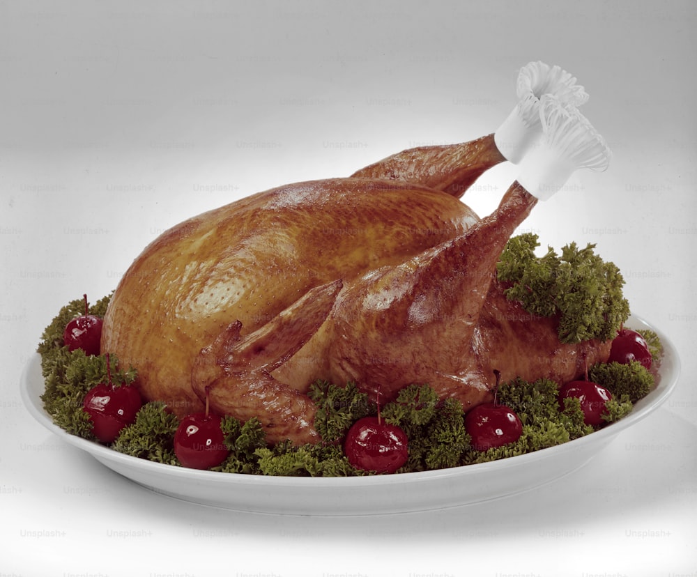 View of a cooked turkey, garnished with lettue and crabapples on a serving platter, 1966. (Photo by Tom Kelley/Getty Images)