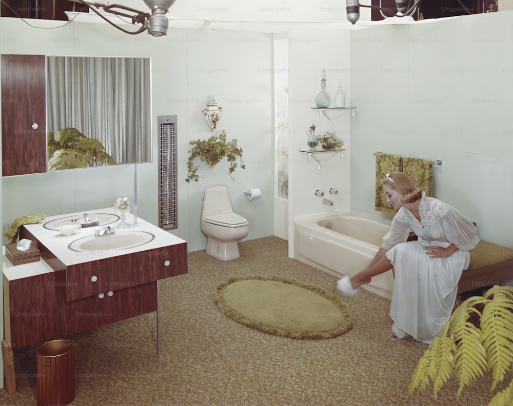 a woman sitting on a bench in a bathroom