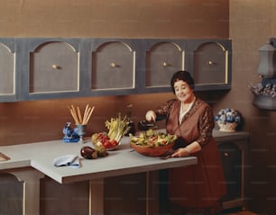 a woman in a kitchen preparing food on a counter