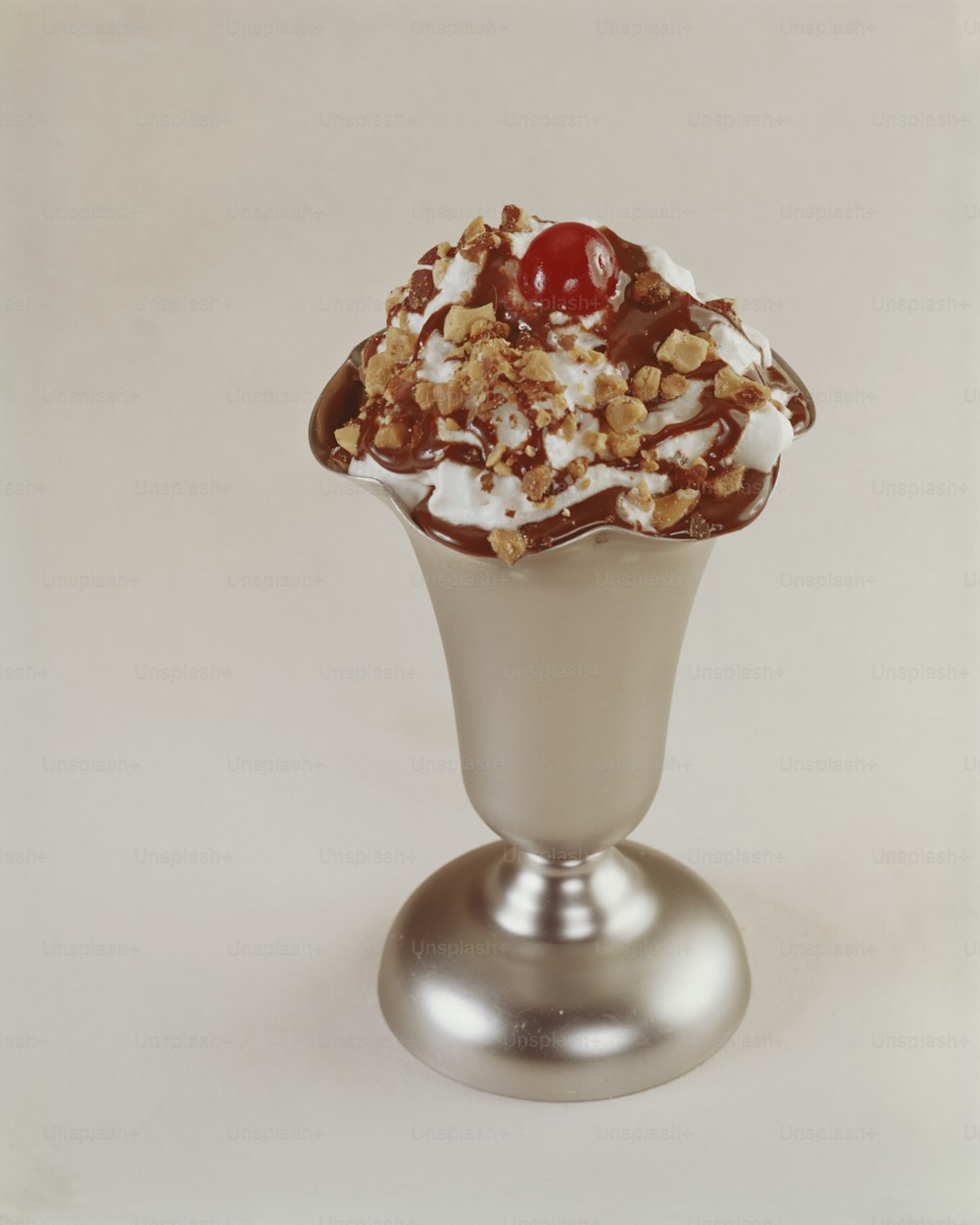an ice cream sundae with a cherry on top