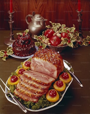 a platter of meat and fruit on a table