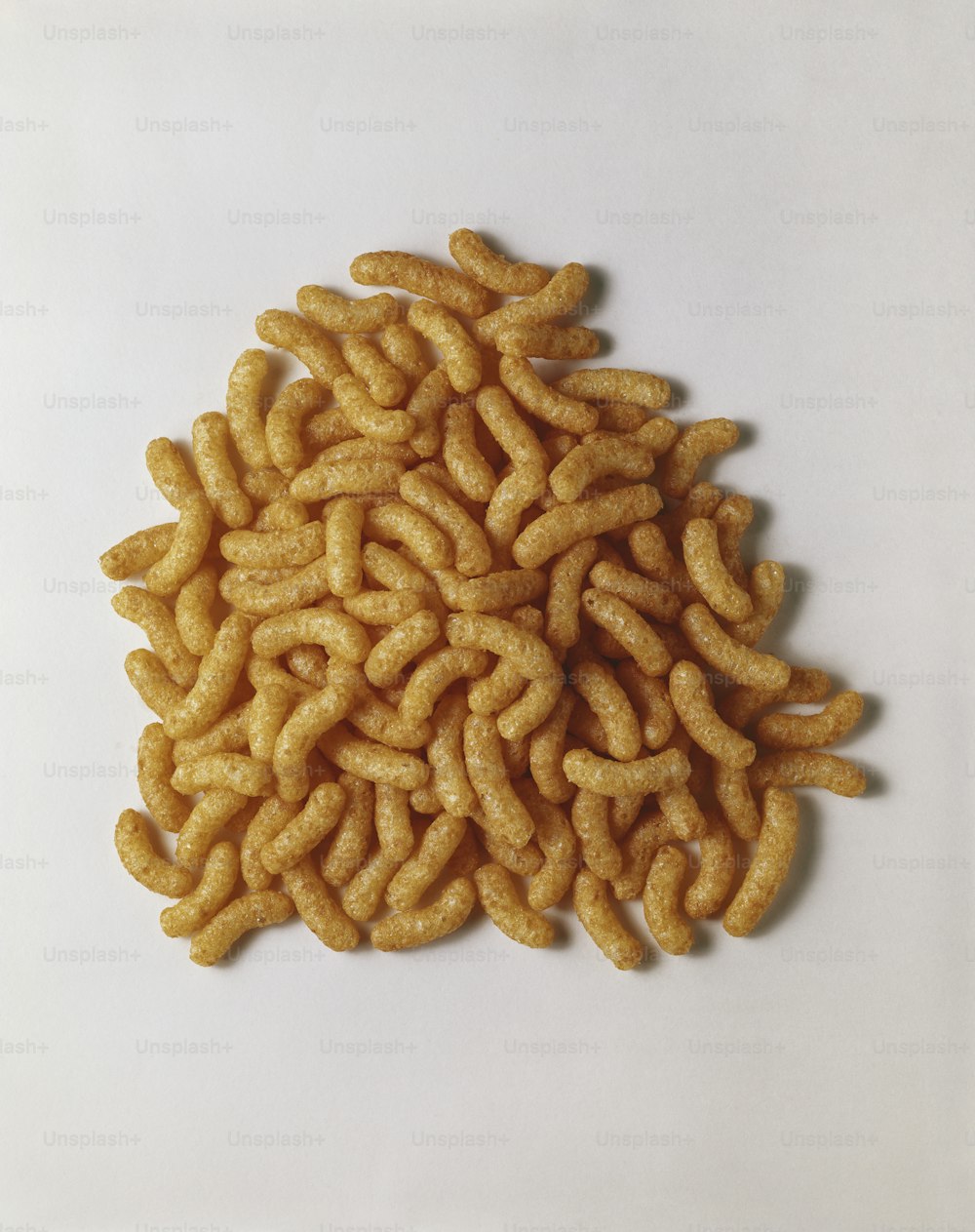 a pile of fried food sitting on top of a white table