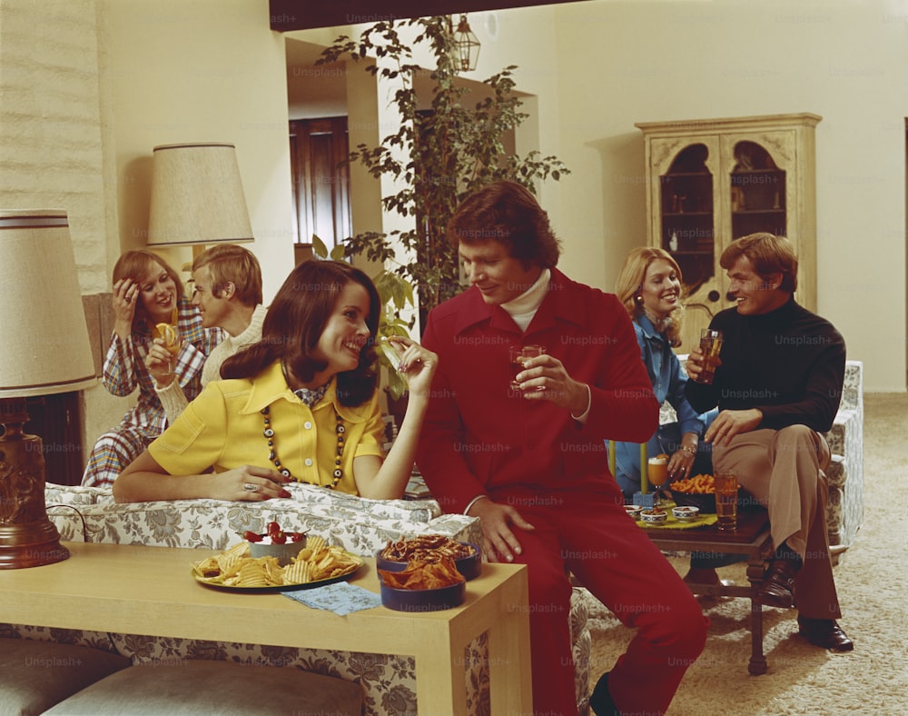 a group of people sitting around a table eating food