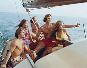 a group of people riding on the back of a boat