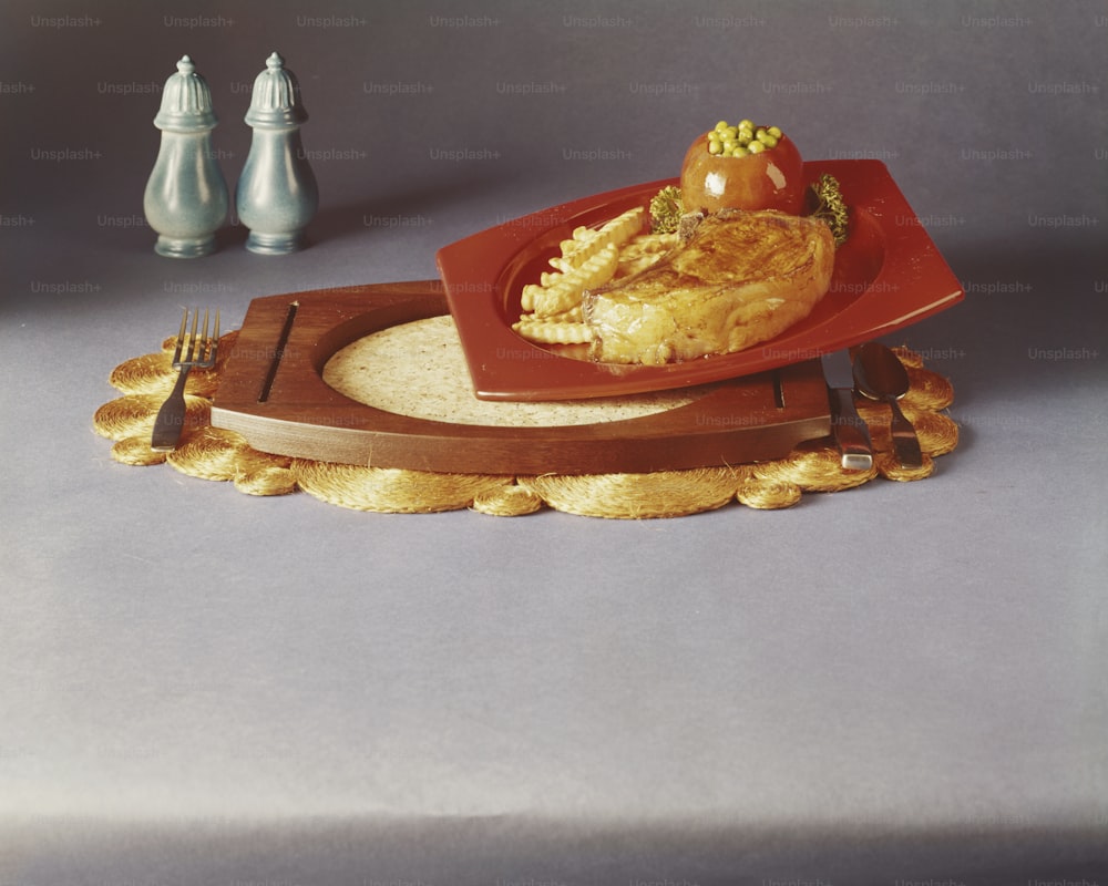 a plate of food on a tray with a fork
