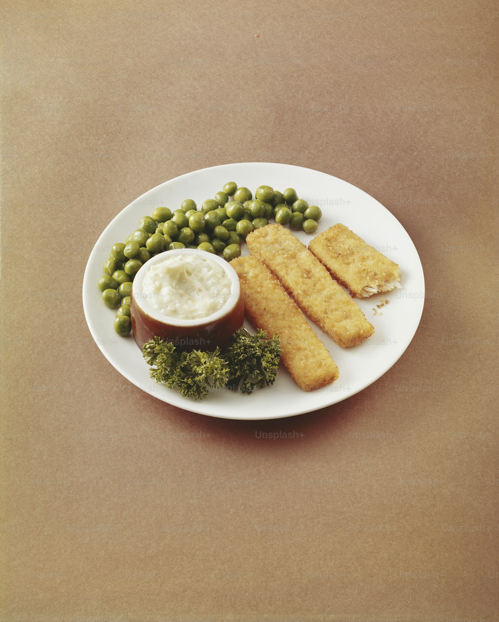 a plate of food with peas, peas, and bread