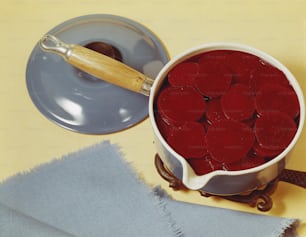 a bowl of beets sitting on top of a table