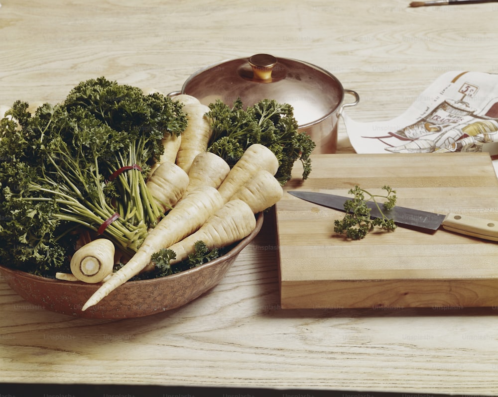 a wooden cutting board topped with lots of veggies