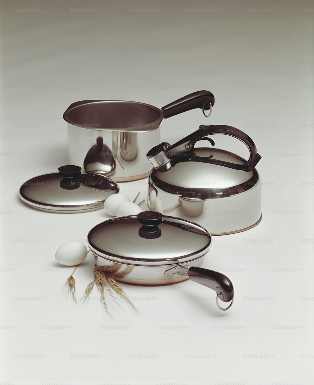 a group of pots and pans sitting on a table