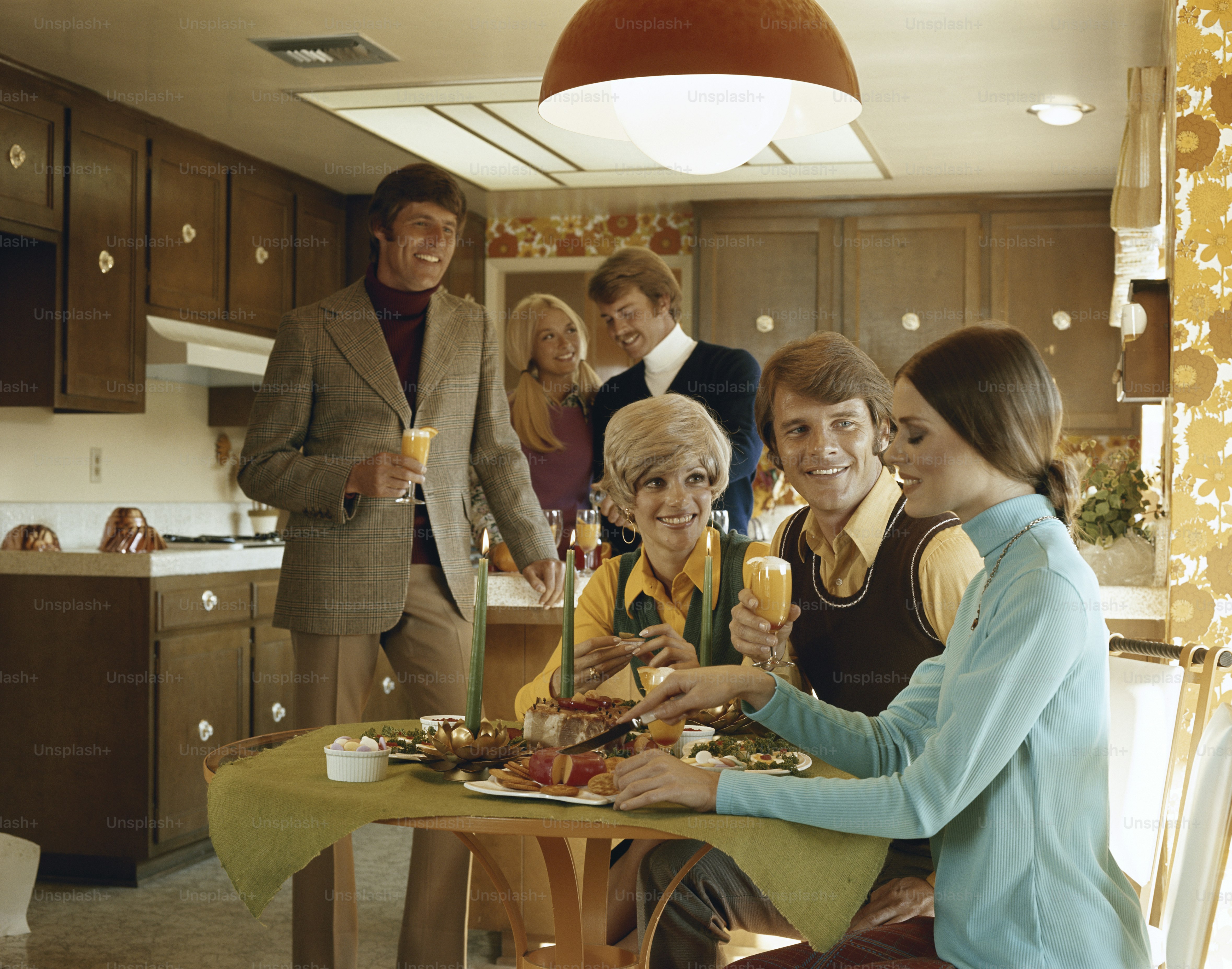 a group of people sitting around a table eating food