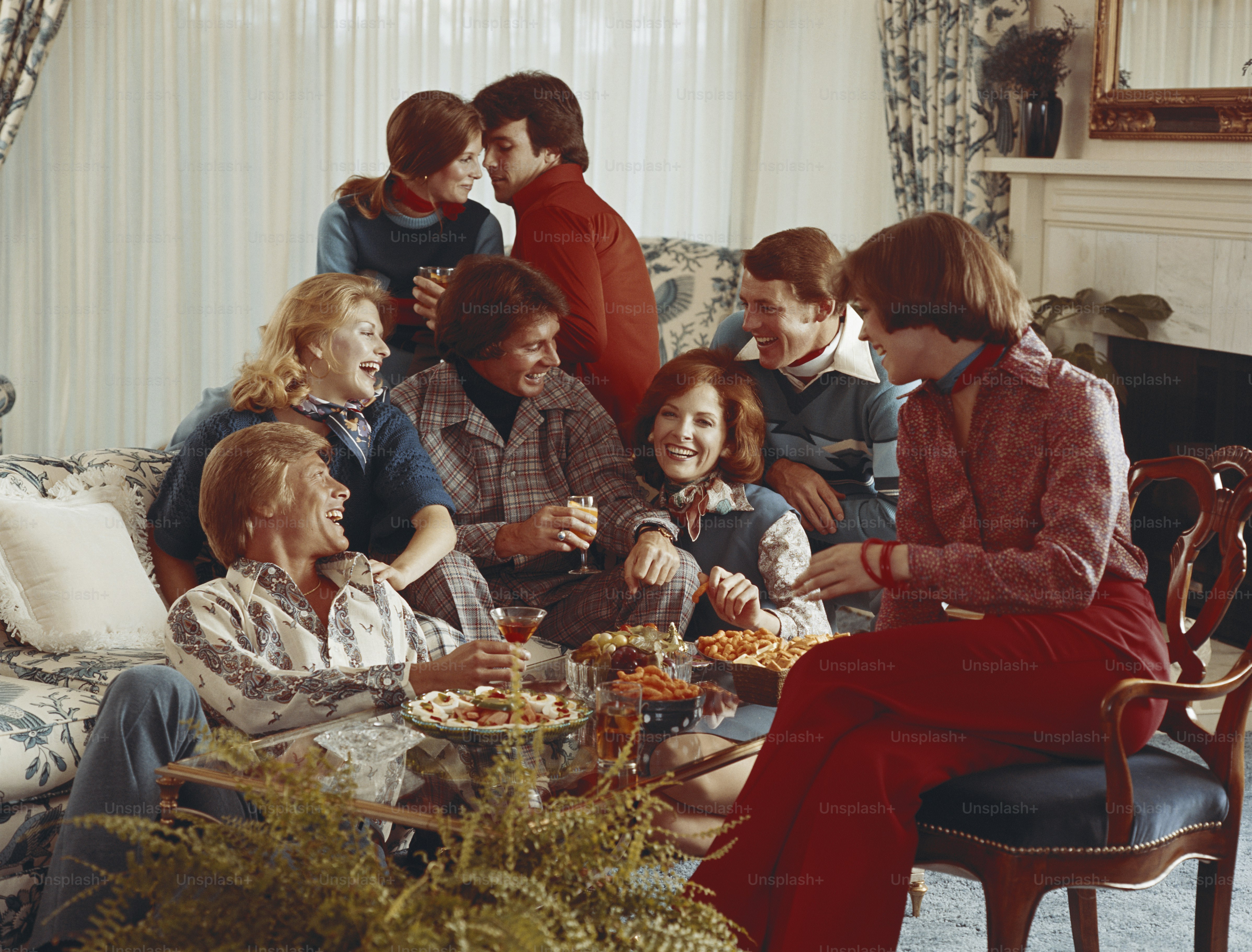 a group of people sitting around a table eating food