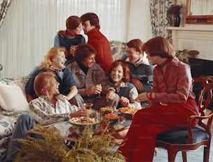 a group of people sitting around a table eating food