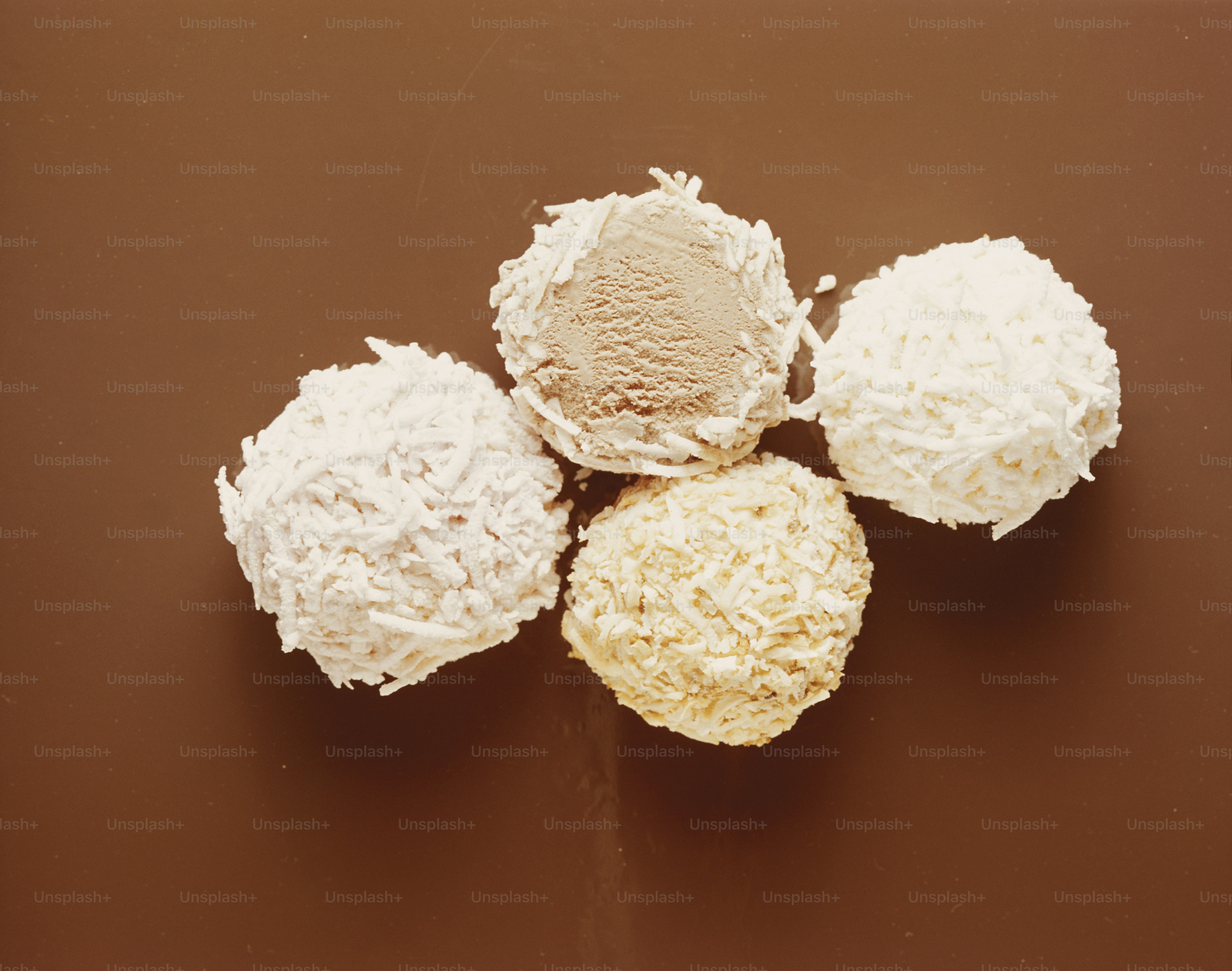 three different types of desserts on a brown surface