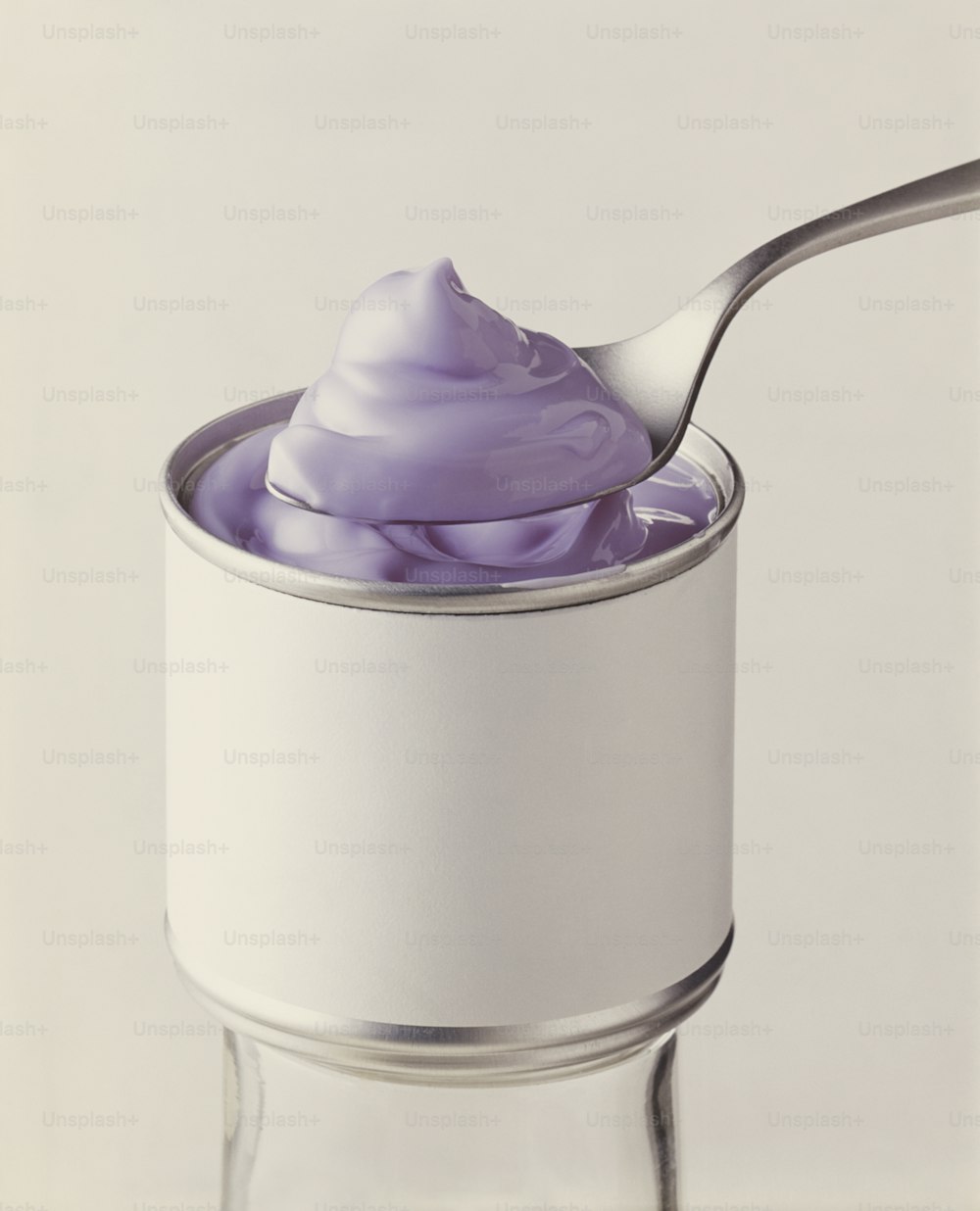 a spoon with a purple substance in it