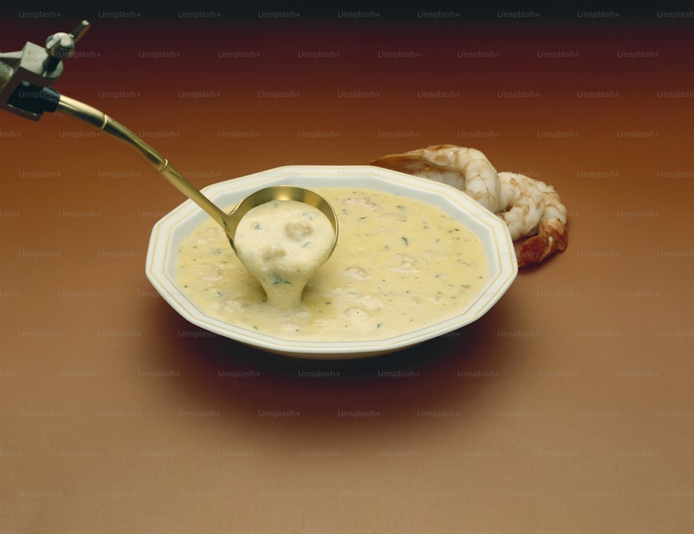 a bowl of soup with a spoon in it