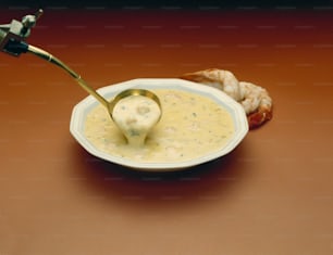 a bowl of soup with a spoon in it
