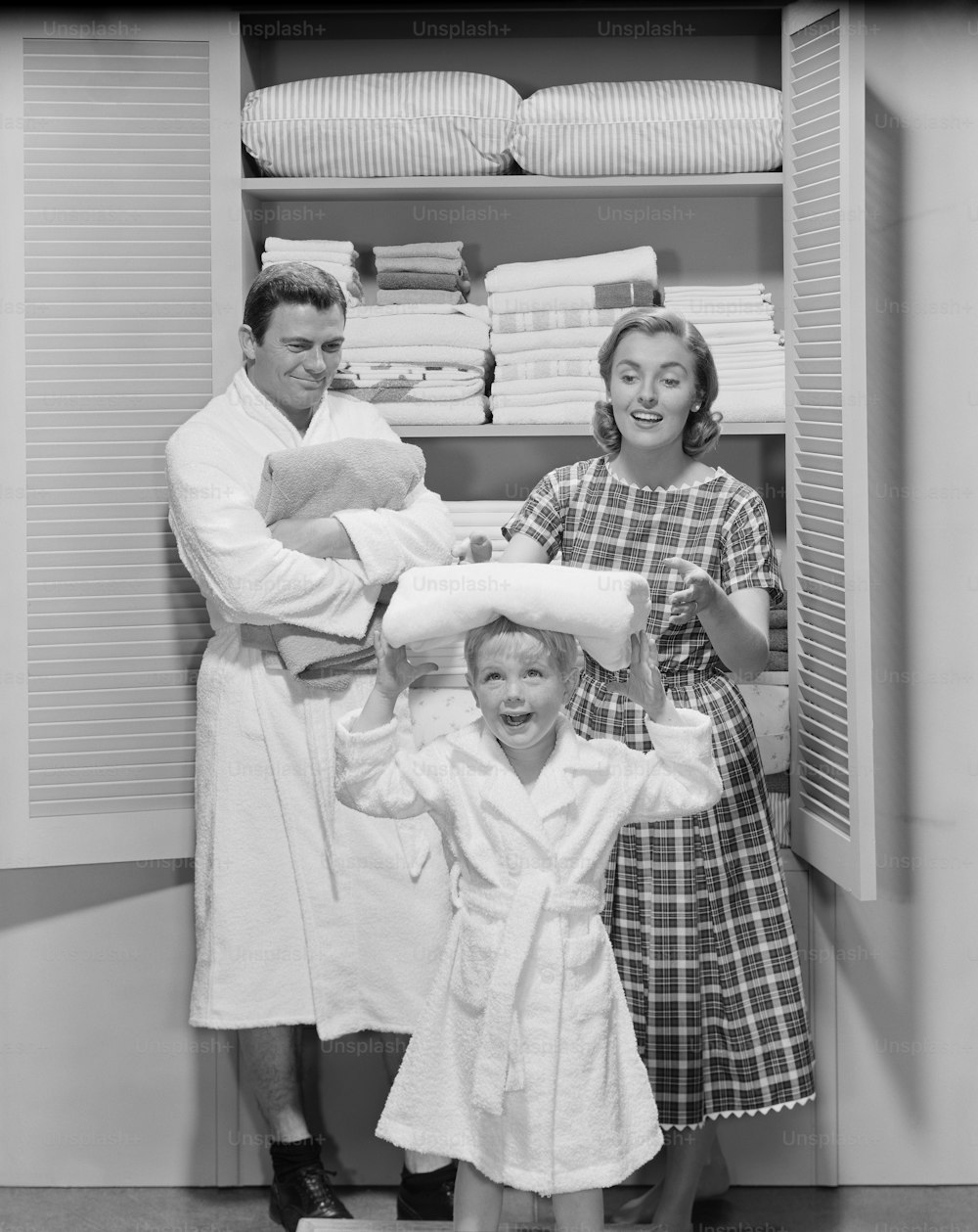 a couple of people that are standing in a closet