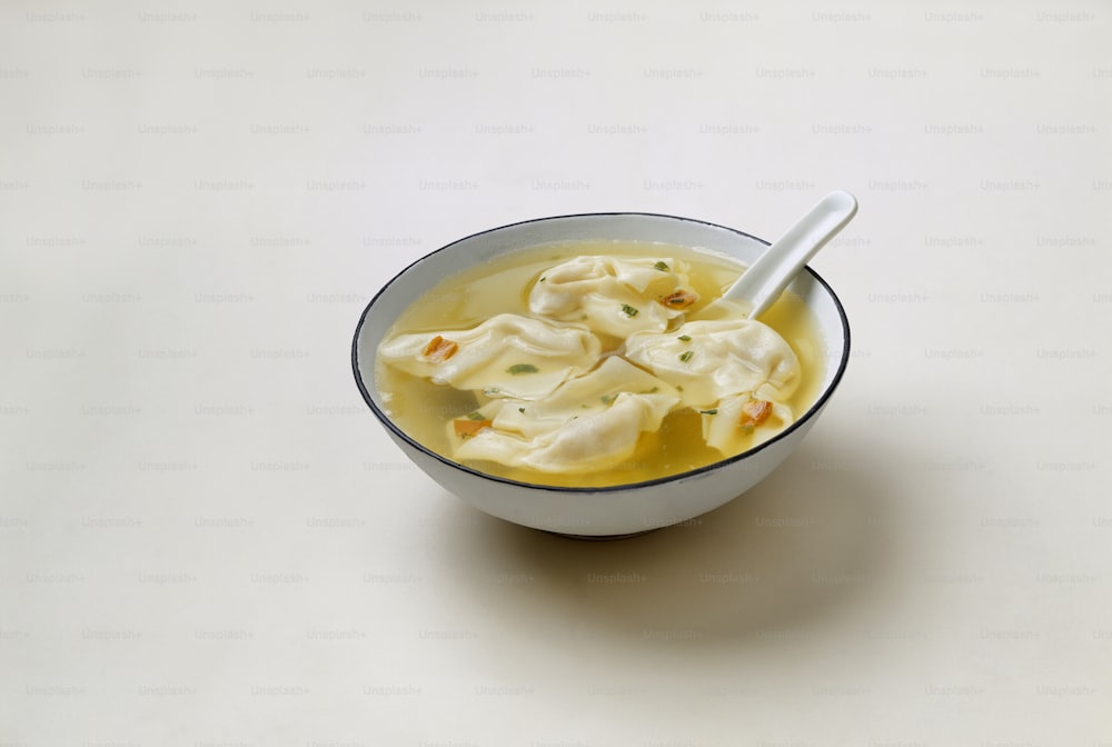 a bowl of soup with a spoon in it