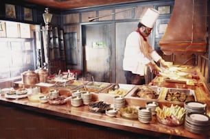 a chef preparing food in a restaurant kitchen