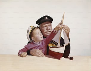 Una pintura de un hombre sosteniendo a un niño pequeño