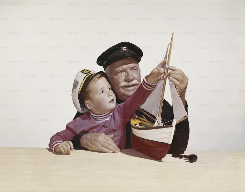 a painting of a man holding a small child