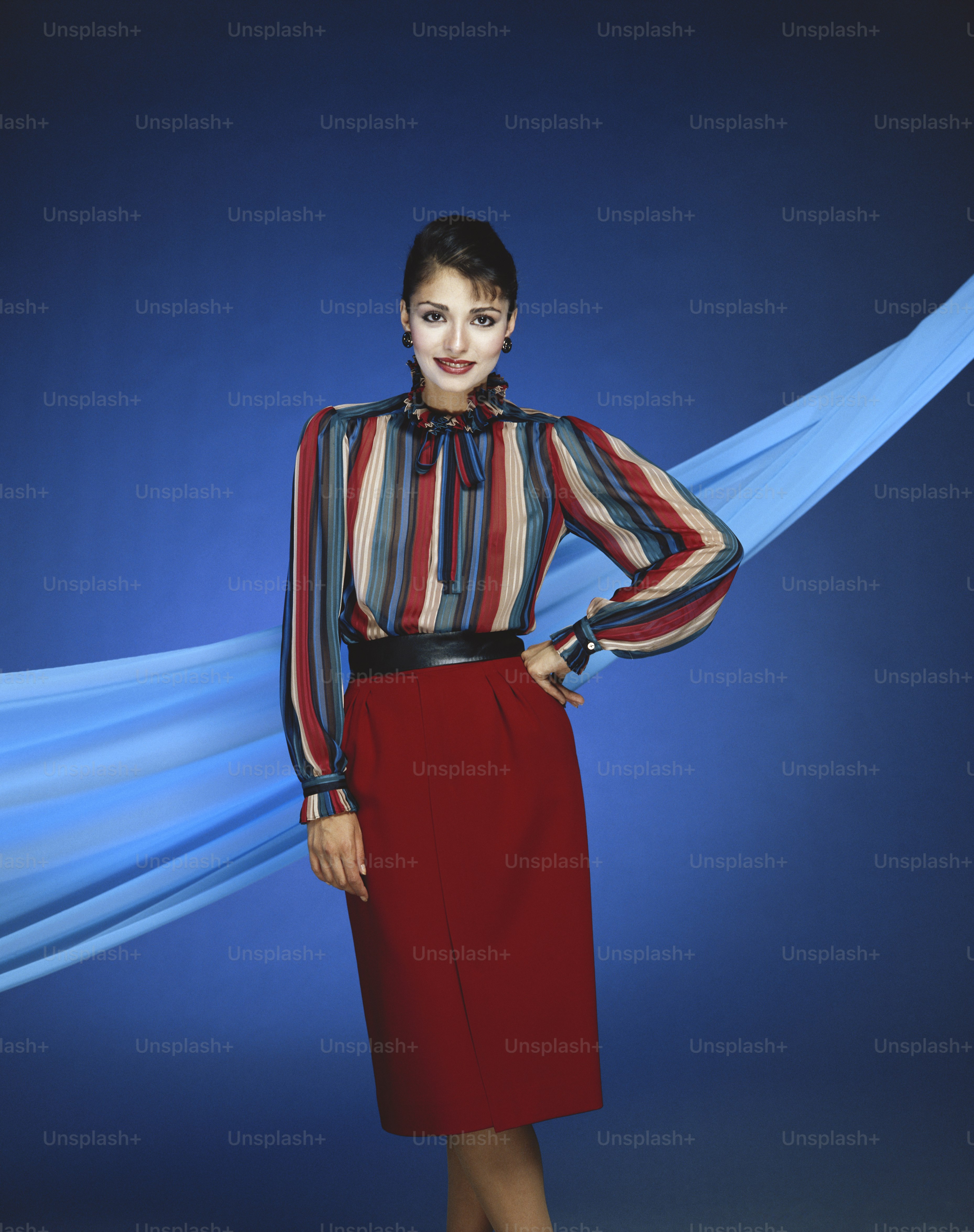 A woman in a striped shirt and red skirt photo – Fashion Image on Unsplash