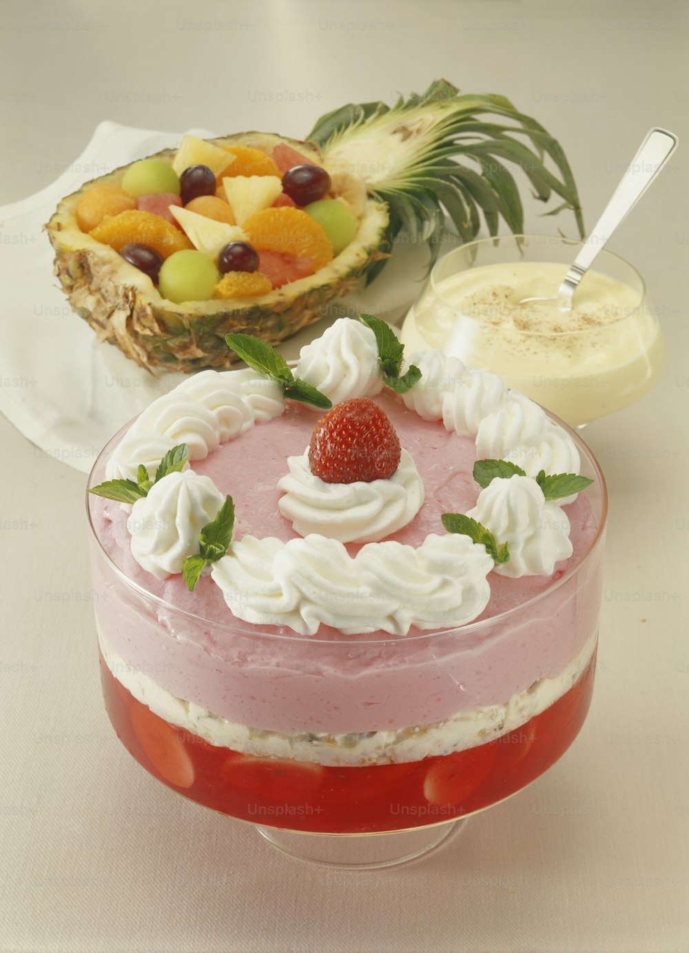 a cake with fruit on top of it on a table