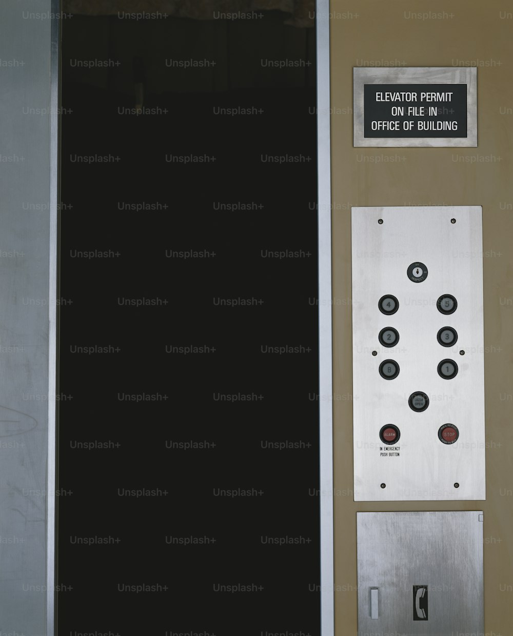a door with buttons and a sign on it