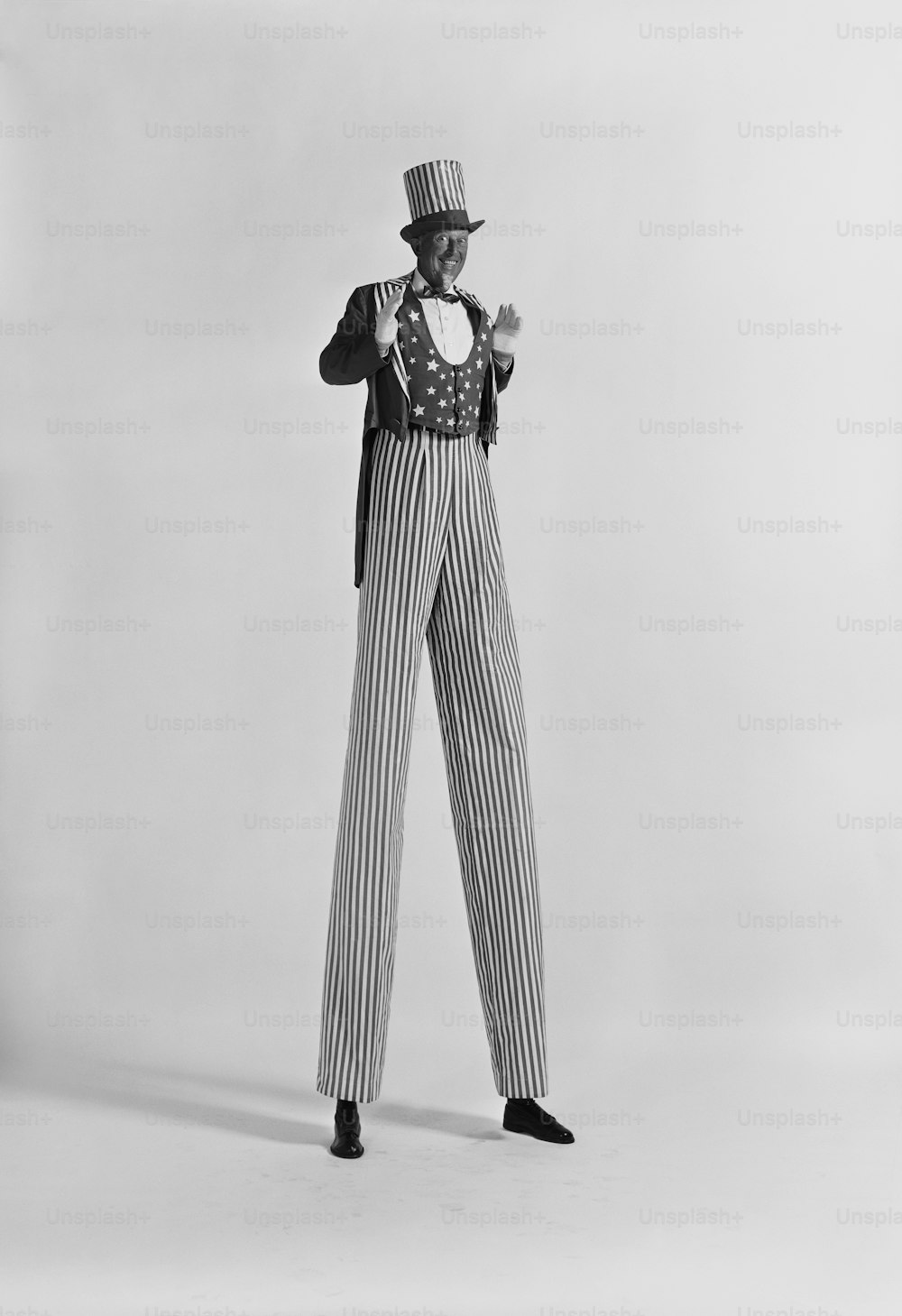 a man in a top hat and striped pants