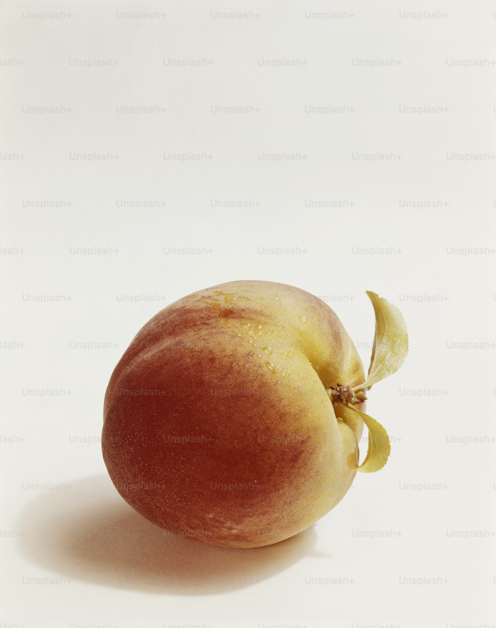 a peach with a bite taken out of it