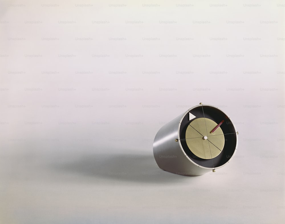 a clock sitting on top of a white table