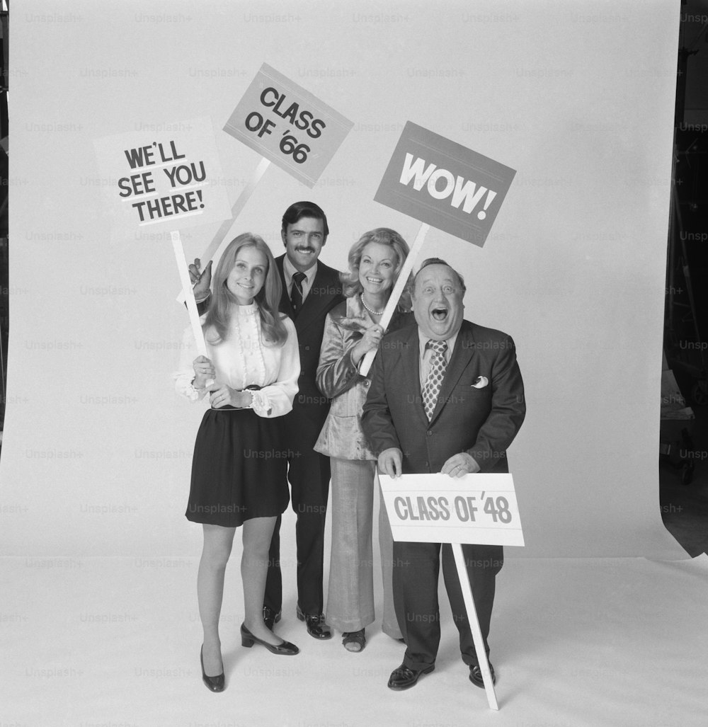 a black and white photo of a group of people holding signs