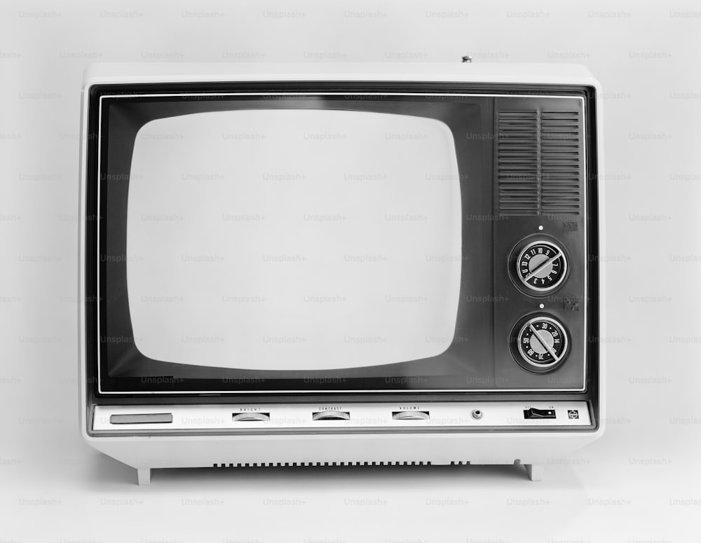 a black and white photo of an old tv