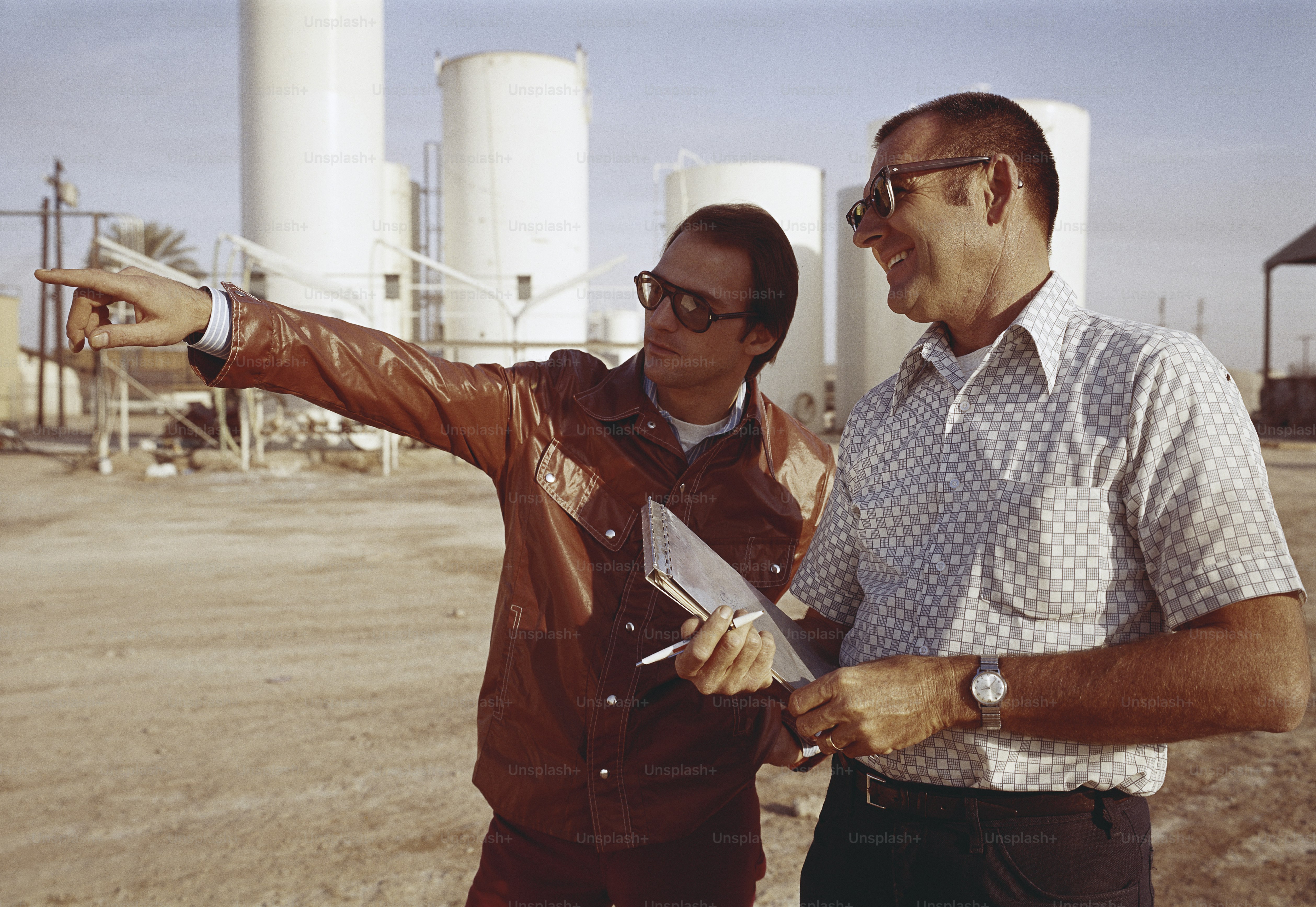 a couple of men standing next to each other