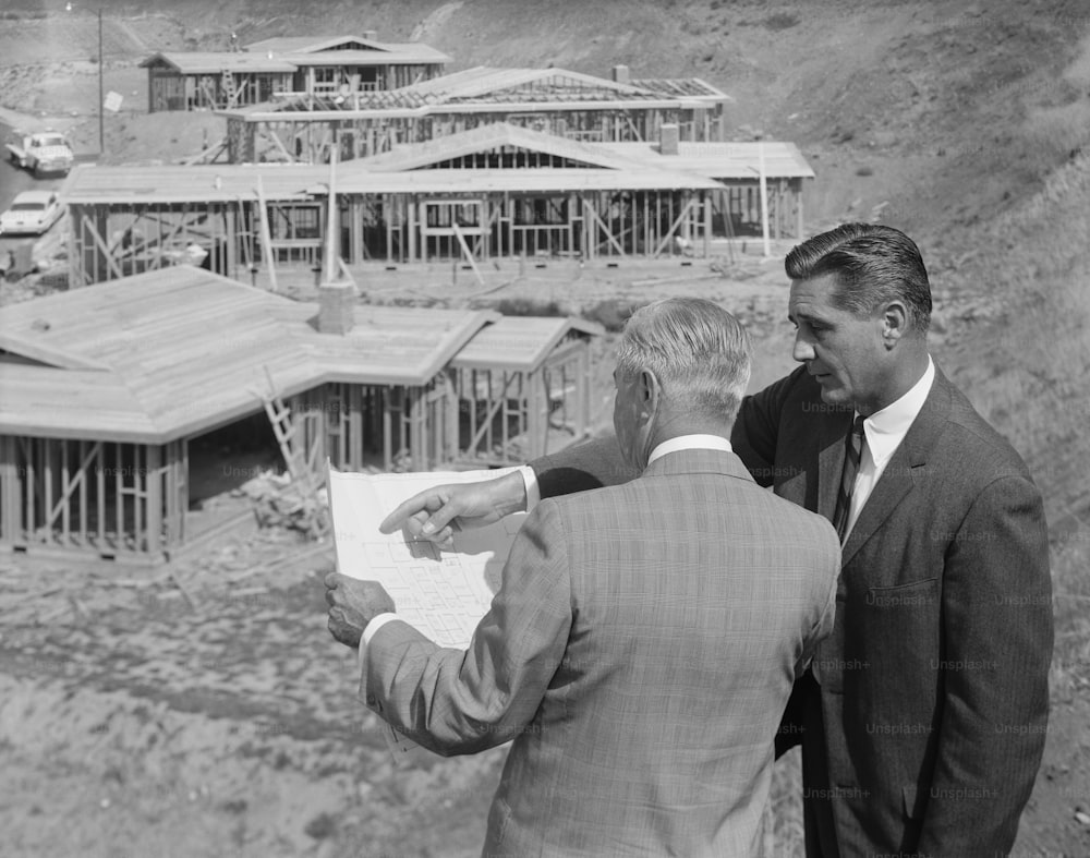 a couple of men standing next to each other