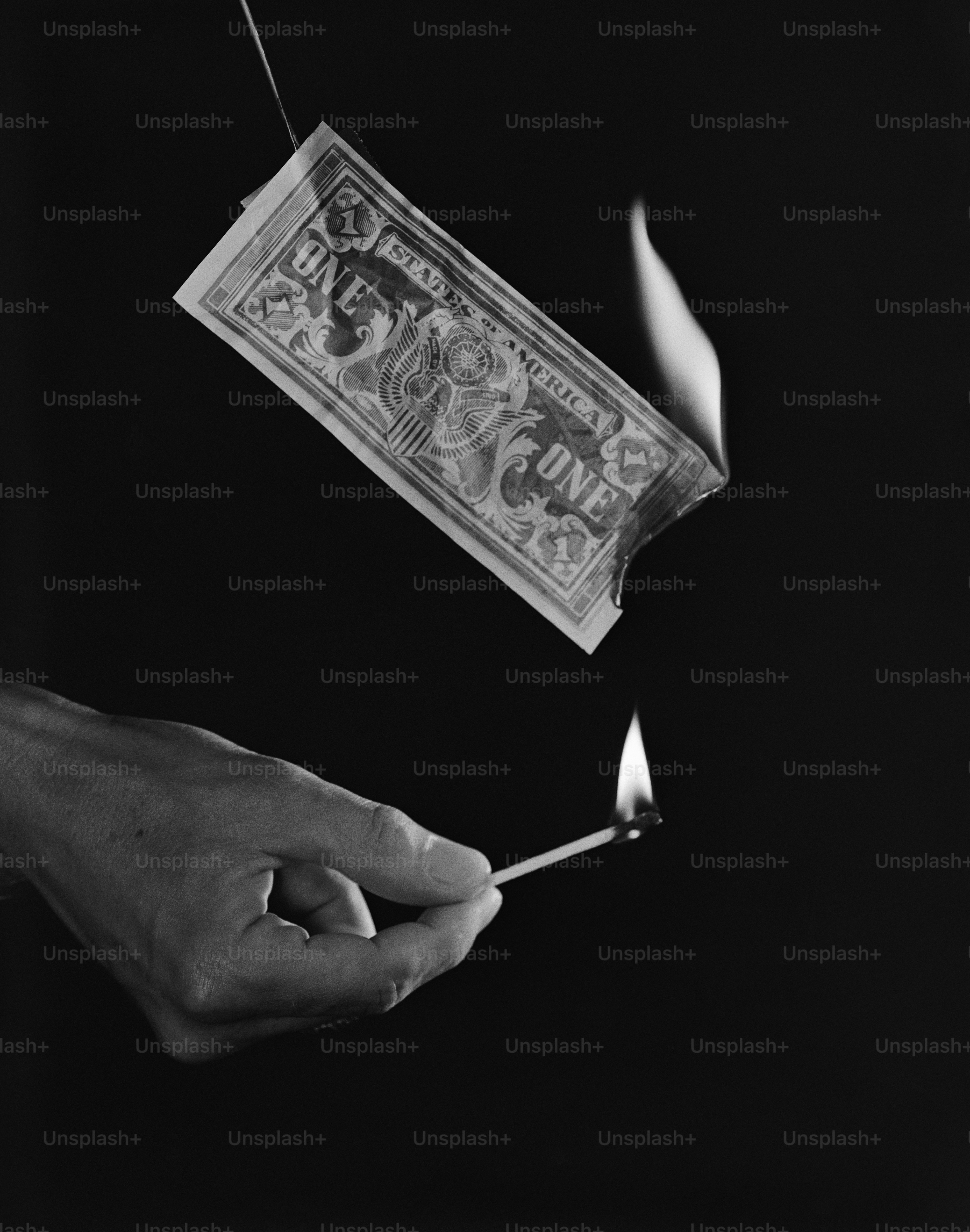 a person holding a lit match in their hand