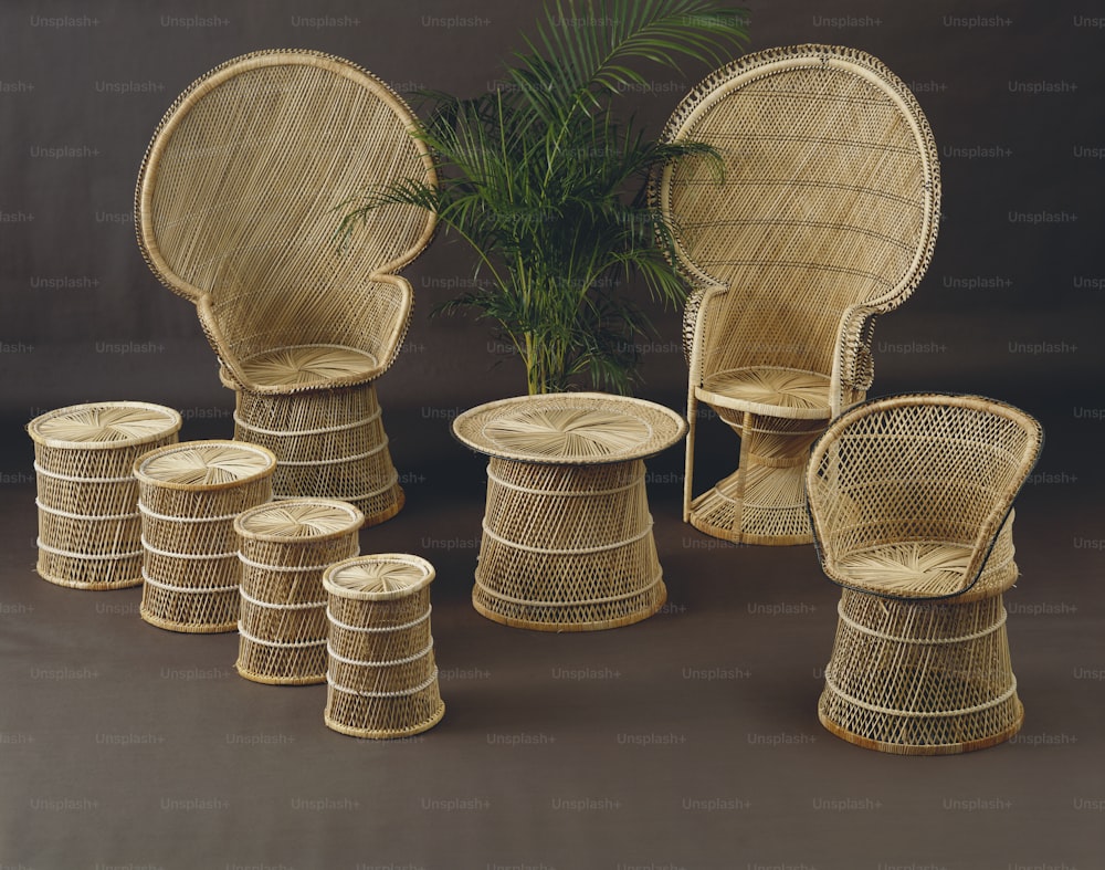 a collection of wicker chairs and stools